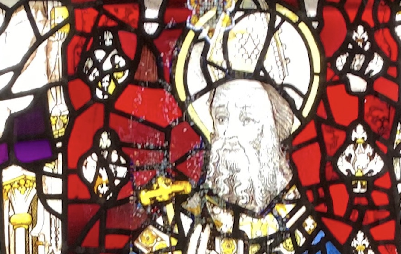 Stained glass featuring the figure of St Cuthbert
